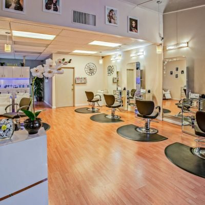 Spacious and stylish hair salon interior in Del Mar, CA showcasing chic design.